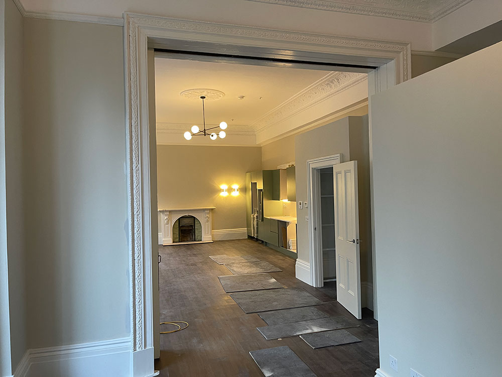 room with fireplace and lighting